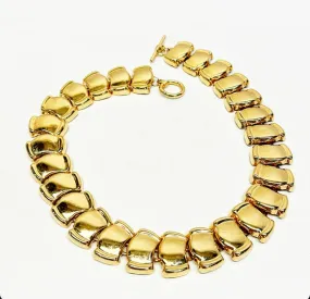 Chunky gold tone metal statement link style necklace.